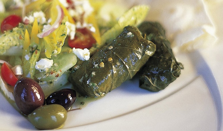 Lemon-Infused Greek Salad with Grape Leaves.