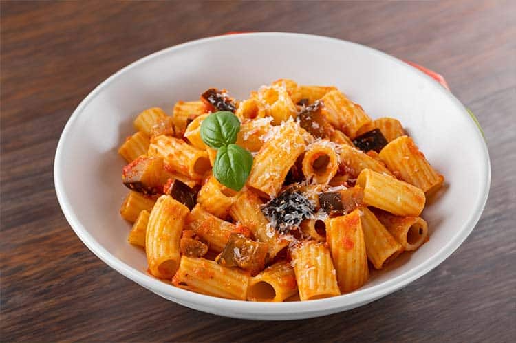 Pasta alla norma in a white bowl