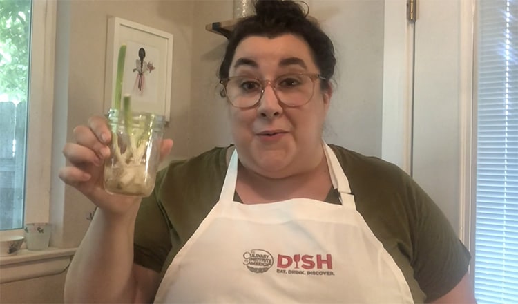 DISH editor holding scallions