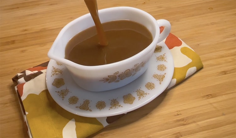 Pouring vegetarian gravy into a gravy boat