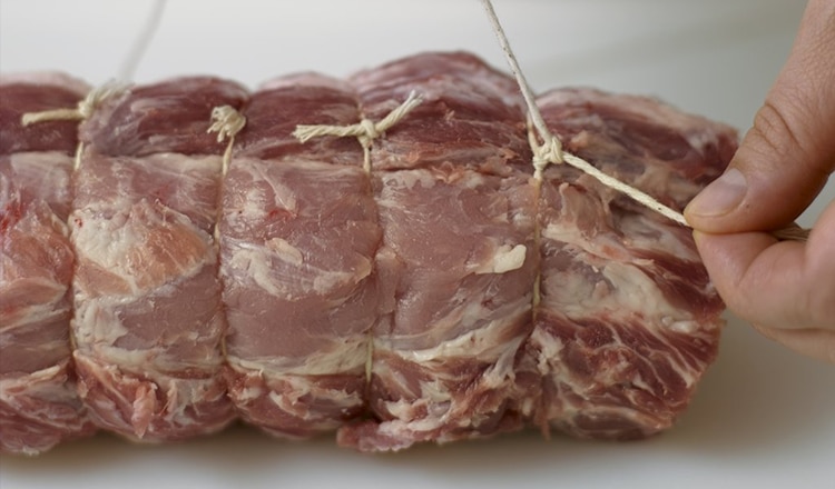 Tying knots on a pork roast