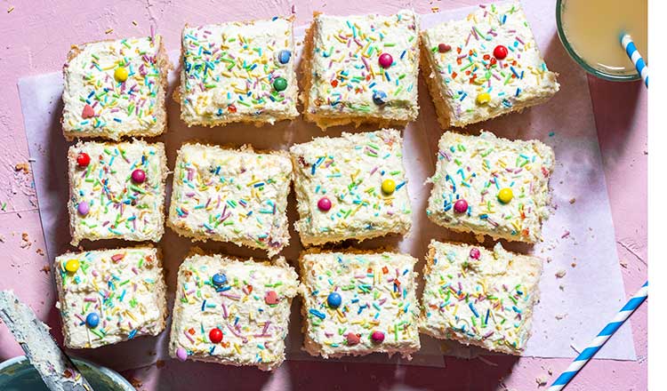 Yellow sheet cake with frosting and sprinkles