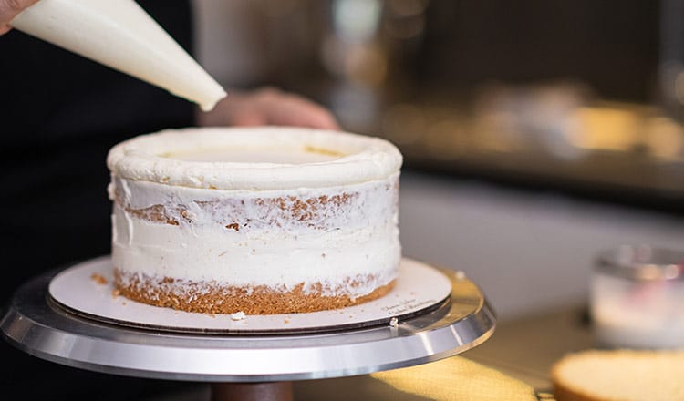 layer cake being iced