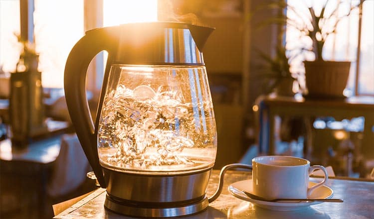 Water boiling in a glass electric kettle.