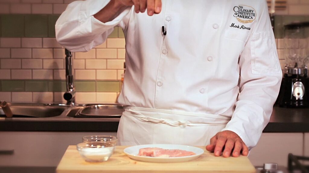 Using Salt and Pepper to Season Food