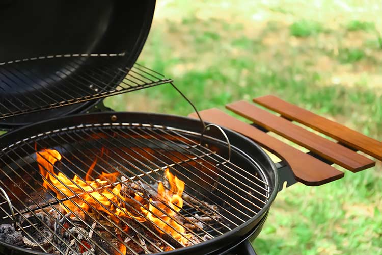Charcoal grill with open lid