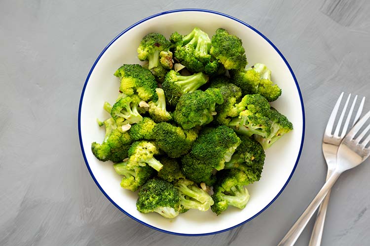 Sauteed broccoli on a white plate